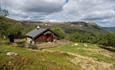 Eine Berghütte an der Baumgrenze