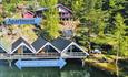 The property seen from the water with thre boat sheds that are not for rent.