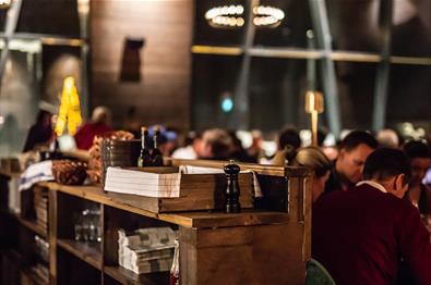 Stylish bar counter made from old wooden shelves