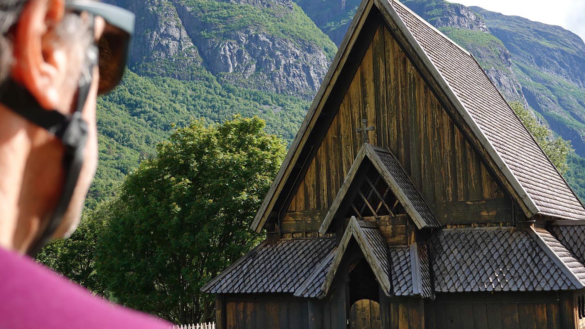 cyclist in front of Stave Church