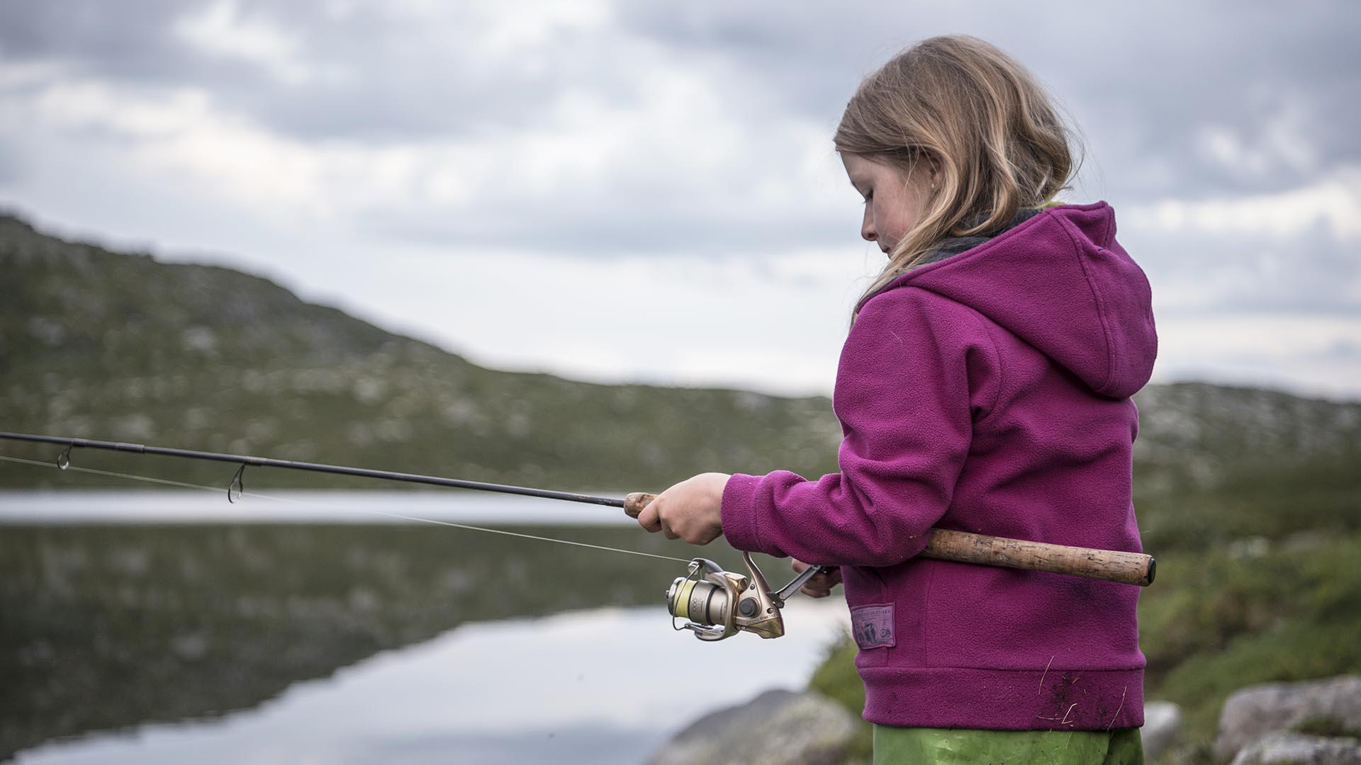 Young girl is fishing