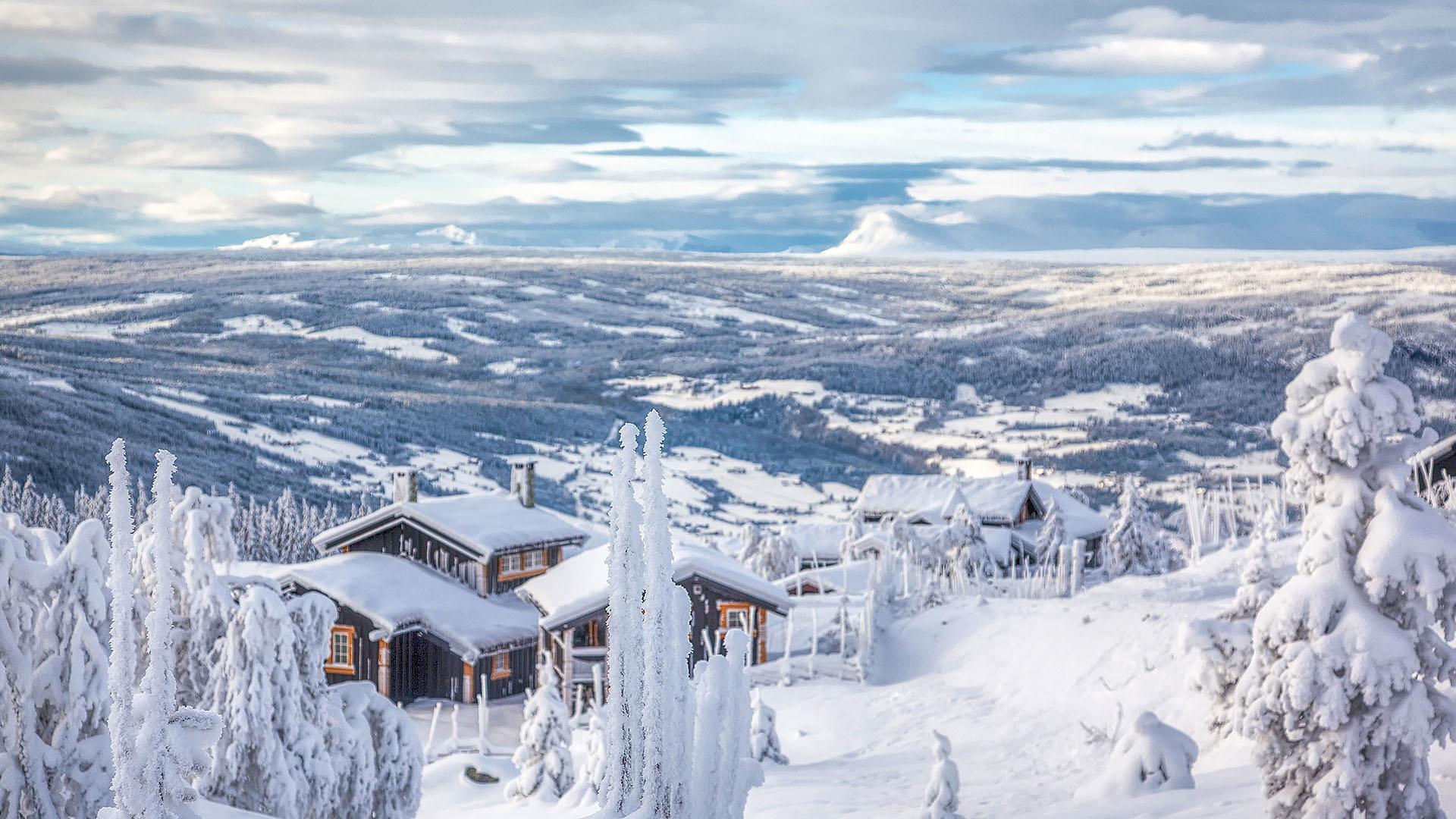 Cabin in snowy mountain landscape