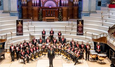 A picture of Black Dyke Band on a concert hall stage