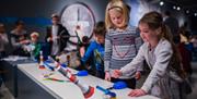 Children playing with experiments at the National Science + Media Museum (c) Jody Hartley