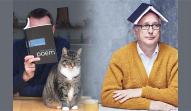 A picture of two men, and a cat. One man is reading a book of poetry, the other is sitting with a book on his head.