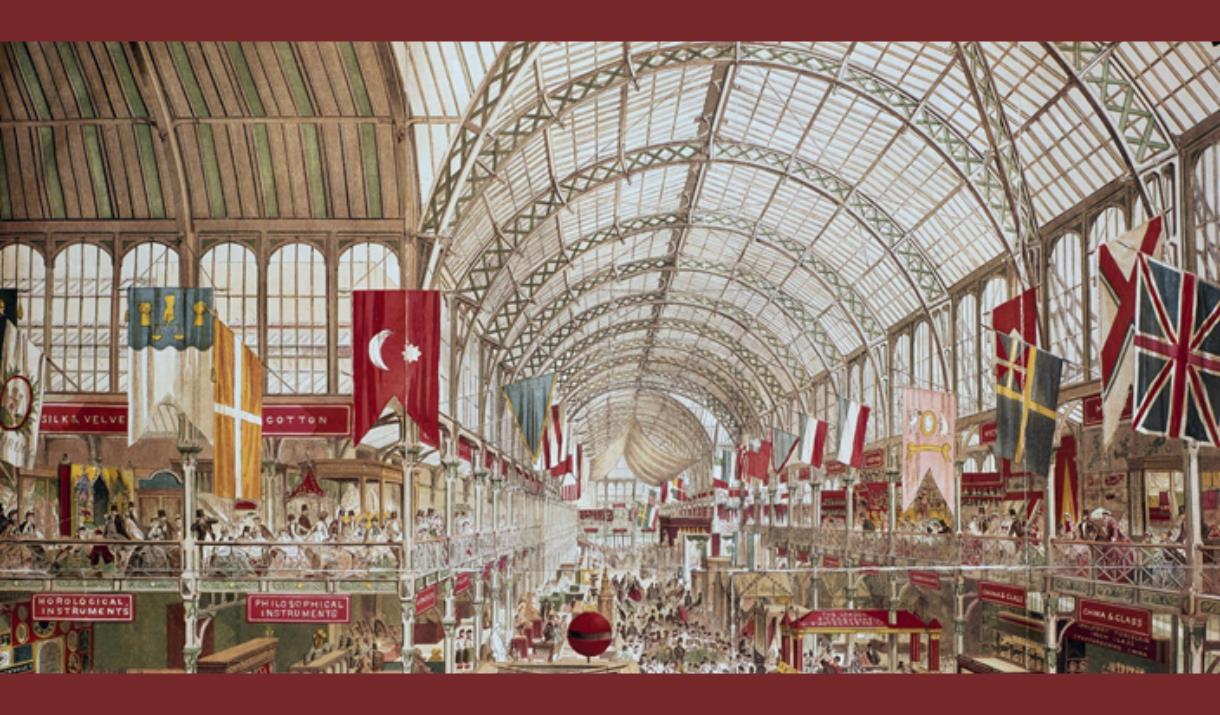 A picture showing a hall at the Great Exhibition of 1851 at Alexandra Palace. There are stands showcasing all types of goods, and there are flags of m
