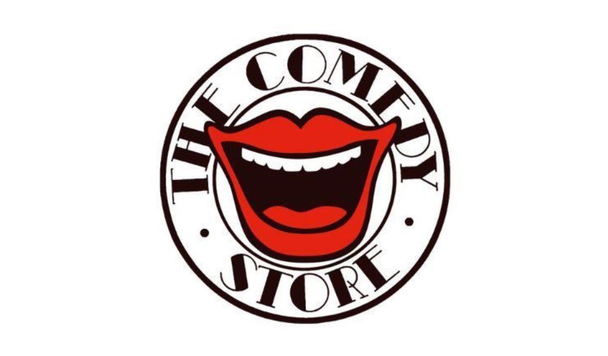 A picture of the comedy store logo, showing a wide-open mouth showing teeth and a tongue, and looking as though it is laughing