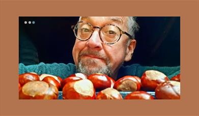 A picture of a man and some conkers