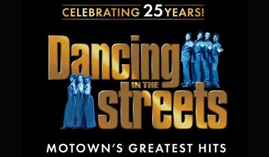 A poster advertising the concert, with "Dancing in the Streets" in large gold letters, and a male and a female group on either side