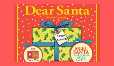 A picture advertising the Dear Santa show, with a parcel wrapped in holly-covered paper and a blue bow.