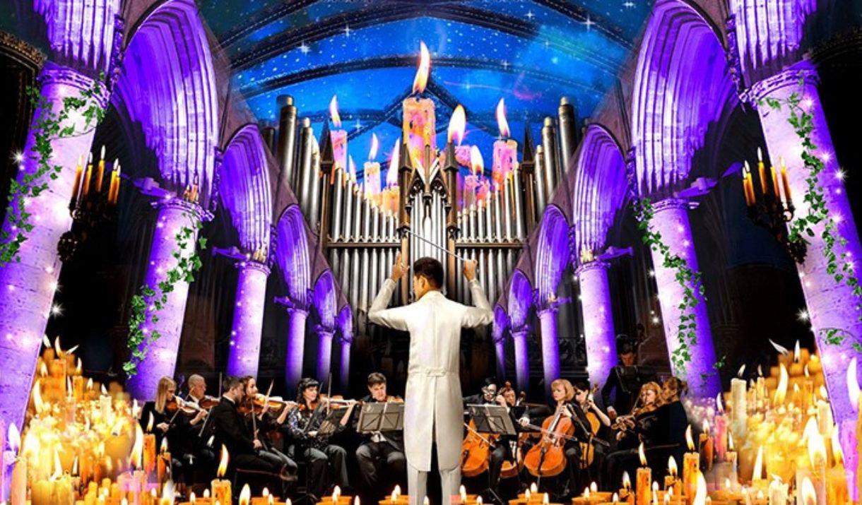 A fantastical picture of a cathedral interior, with an orchestra playing music by candlelight.