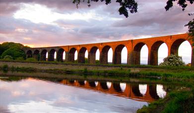 View of Hewenden Viaduct at sunset.