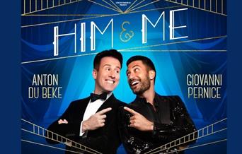 A picture dancers of Anton Du Beke and Giovanni Pernice, smiling and pointing at each other