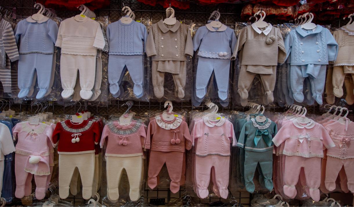 Children's clothing displayed at Kirkgate Market in Bradford.