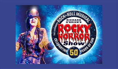 A poster advertising the 50th anniversary of The Rocky Horror Show, showing a woman in a sparkly jacket and top hat