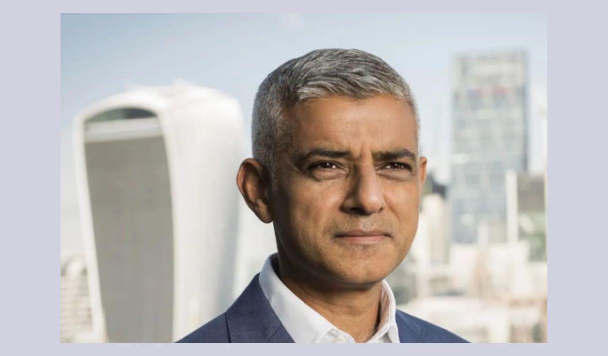 A head and shoulders picture of London mayor Sadiq Khan, against a backdrop of London