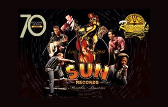 A picture of musicians performing as some of Sun Records stars, with the Sun logo in the middle