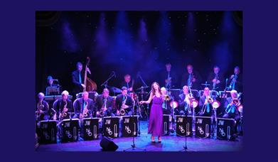 A picture of a big band performing on stage