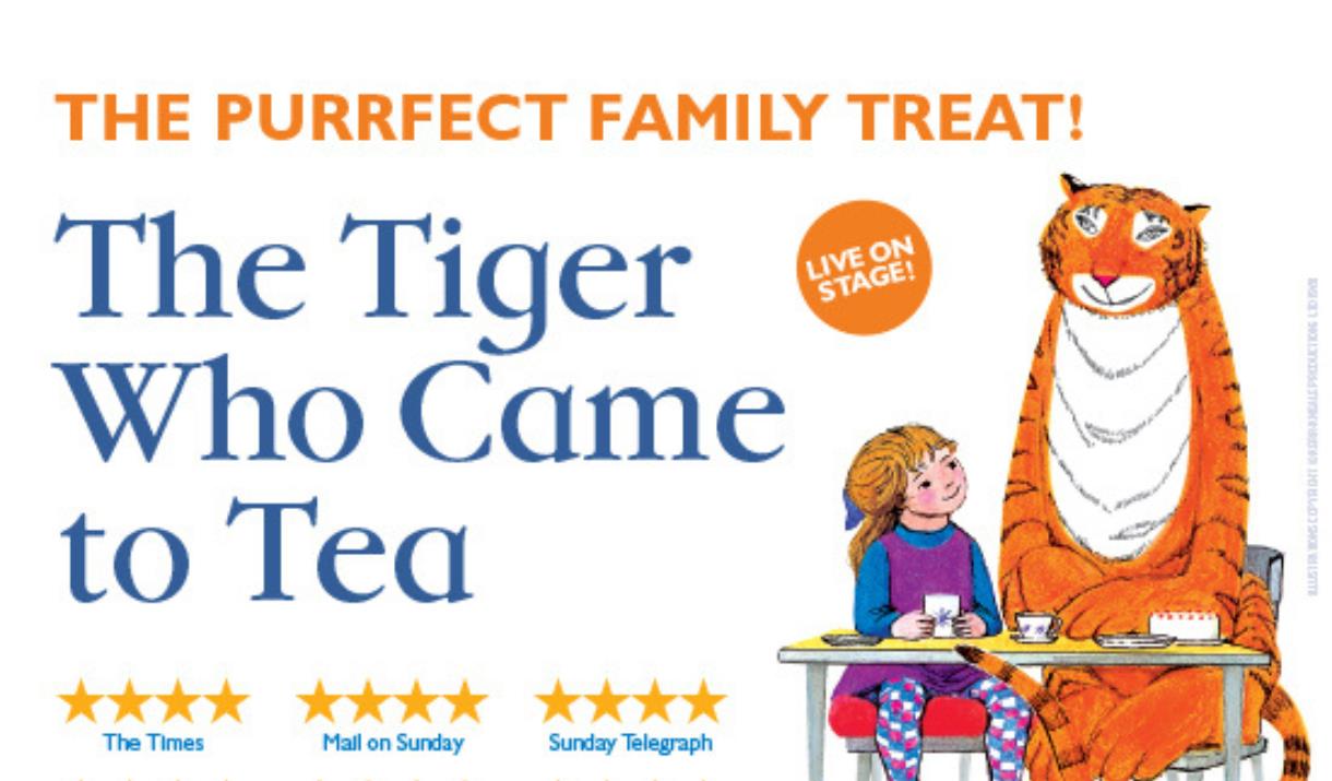 A picture of a tiger and a little girl sitting together at a table with tea things on it