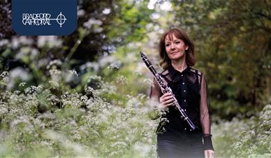 Emma Johnson holding a clarinet.