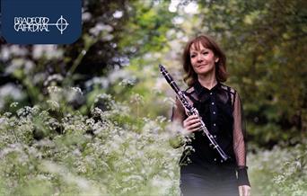 Emma Johnson holding a clarinet.