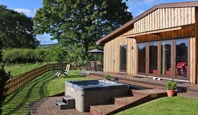 Private hot tub and garden with dining patio and sun loungers