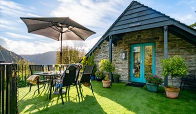 The garden deck outside Tollant with views over the hills and meadows.