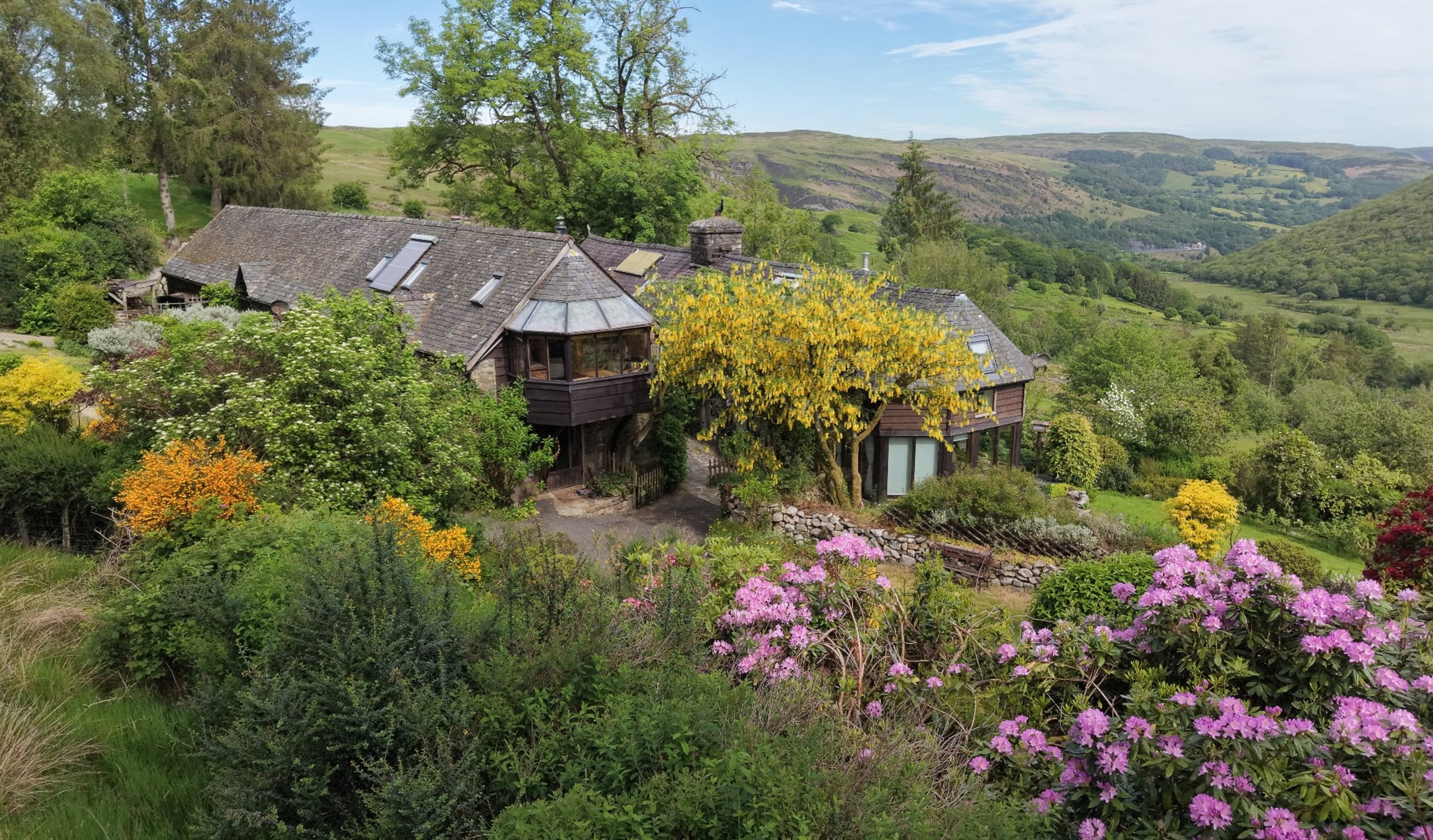 Drone shot exterior of The Clyn with view of surrounding countryside.