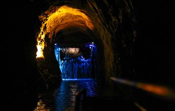 The journey begins, travelling through an underground waterfall