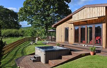 Private hot tub and garden with dining patio and sun loungers