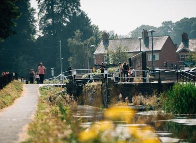 The towpath beside a lock on the Montgomery Canal in Welshpool