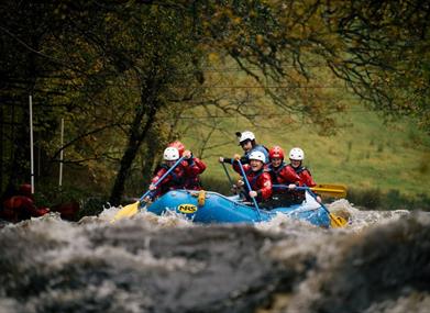 A raft on white water at the National White Water Centre near Bala