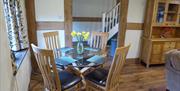 The Farmhouse at Hilltops Brecon Holiday Cottages has a ample sofas, a log-burner and fully fitted kitchen