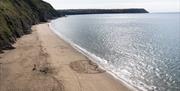 Sand Art created on Penbryn Beach to celebrate World Refil Day, 16th June 2022