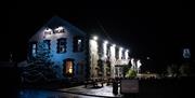 Exterior View of The Angel Inn at night.