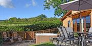 Private hot tub and garden with dining table and sun loungers