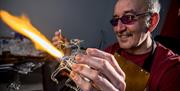 Delyn Glass at Corris Craft Centre work with glass and create stunning sculptures of wildlife, flowers and fantasy dragons. Kevin can be seen at work
