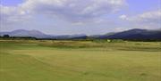 The 7th green and the mountains of Snowdonia