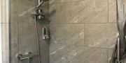 Shower over bath with WC and wash basin