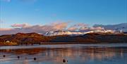 Barmouth in Southern Snowdonia is a great location for Mountain, Sand and Sea. Extensive sandy beach with attractions, water sports and boat trips. Si