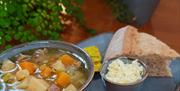 Homemade Welsh Lamb Cawl served with Caerphilly cheese, organic wholemeal bread and Welsh butter