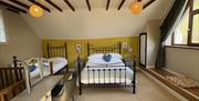 Carthouse Bedroom with king size bed and single bed