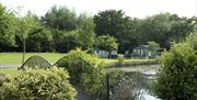 This section of Derwen Mill Holiday Park in Guilsfield, near Welshpool, has a large figure of eight shaped pool in the middle. The large part of the p