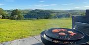 Fire pit and view from Chwefru Pod at Great House Farm