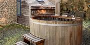The wood fired hot tub outside of Beudy Bach