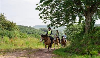 Horse riders on the hills of Bannau Brycheiniog