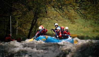 A raft on white water at the National White Water Centre near Bala