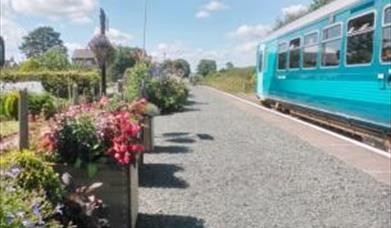 Train pulled in at a platform in Mid-Wales