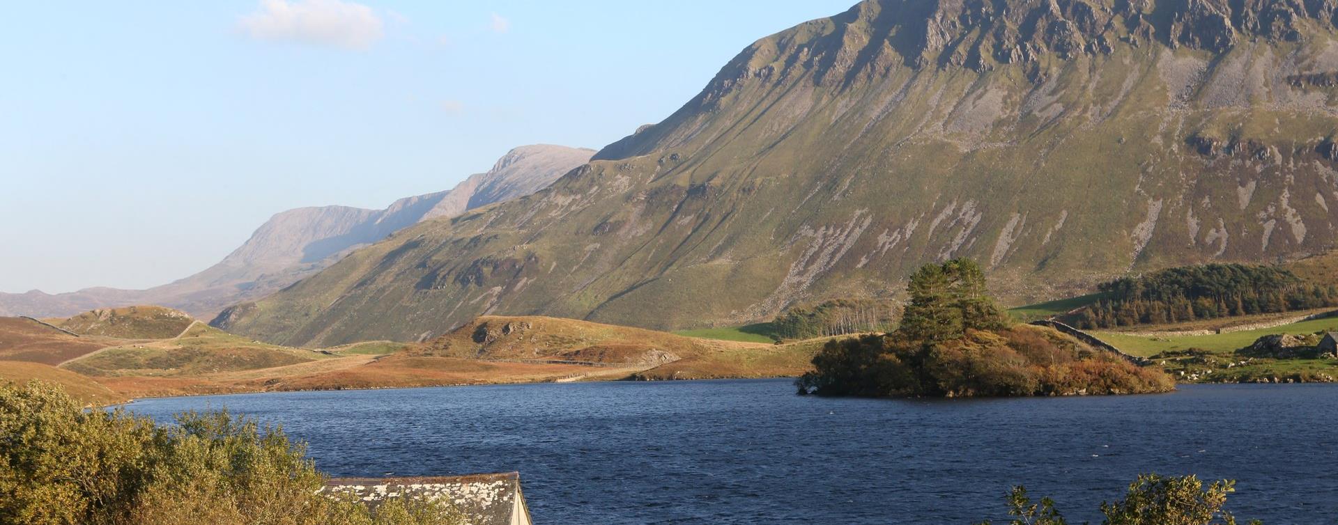 The Cregennan Lakes in evening light below the ridge of Cadair Idris in Southern Eryri