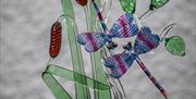 Delyn Glass at Corris Craft Centre create stunning glass sculptures of animals, flowers, fantasy dragons and more. See Kevin at work on most days crea
